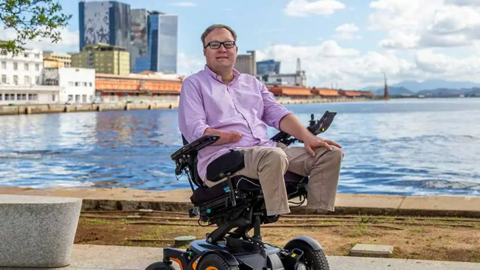 John Morris sitting in his power wheelchair.