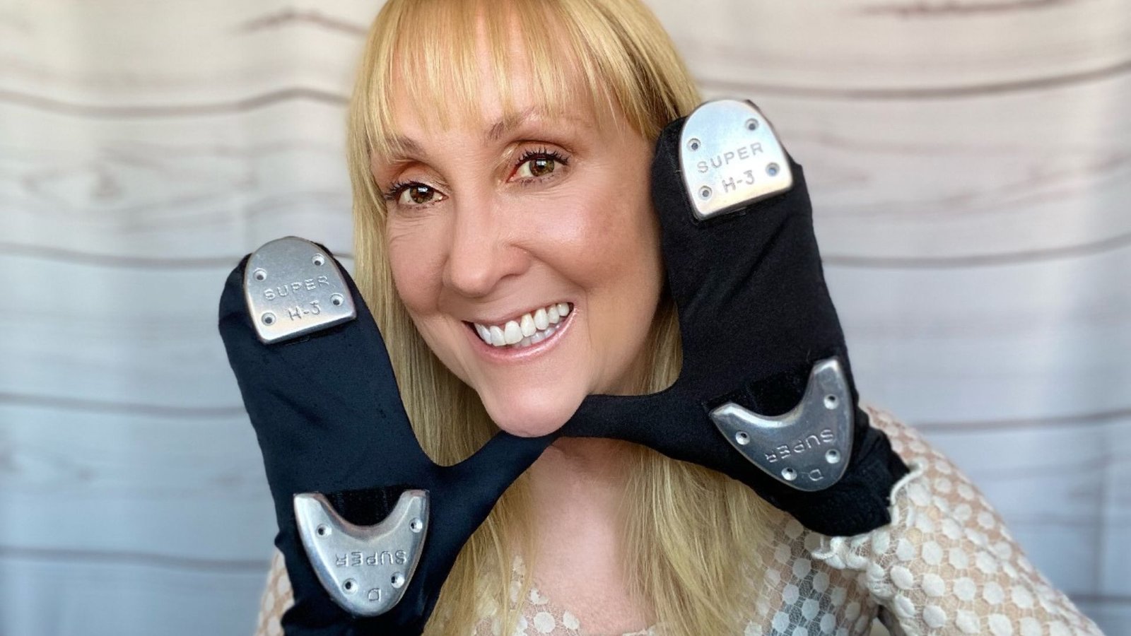 Victoria Moore smiling wearing tap gloves.