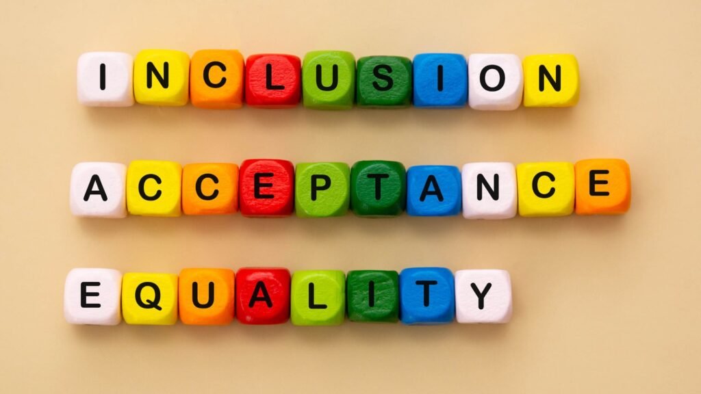 An image of multi-colored blocks with letters spelling out inclusion, acceptance and equality