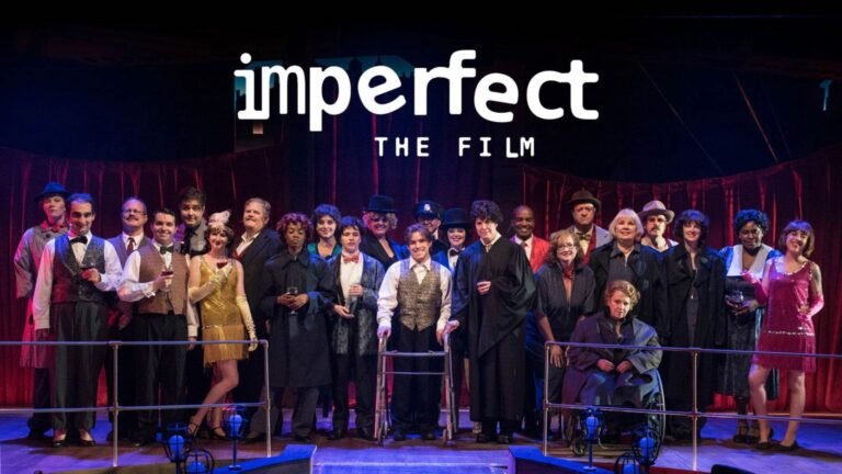The disabled cast of the film Imperfect on a stage in front of a red curtain